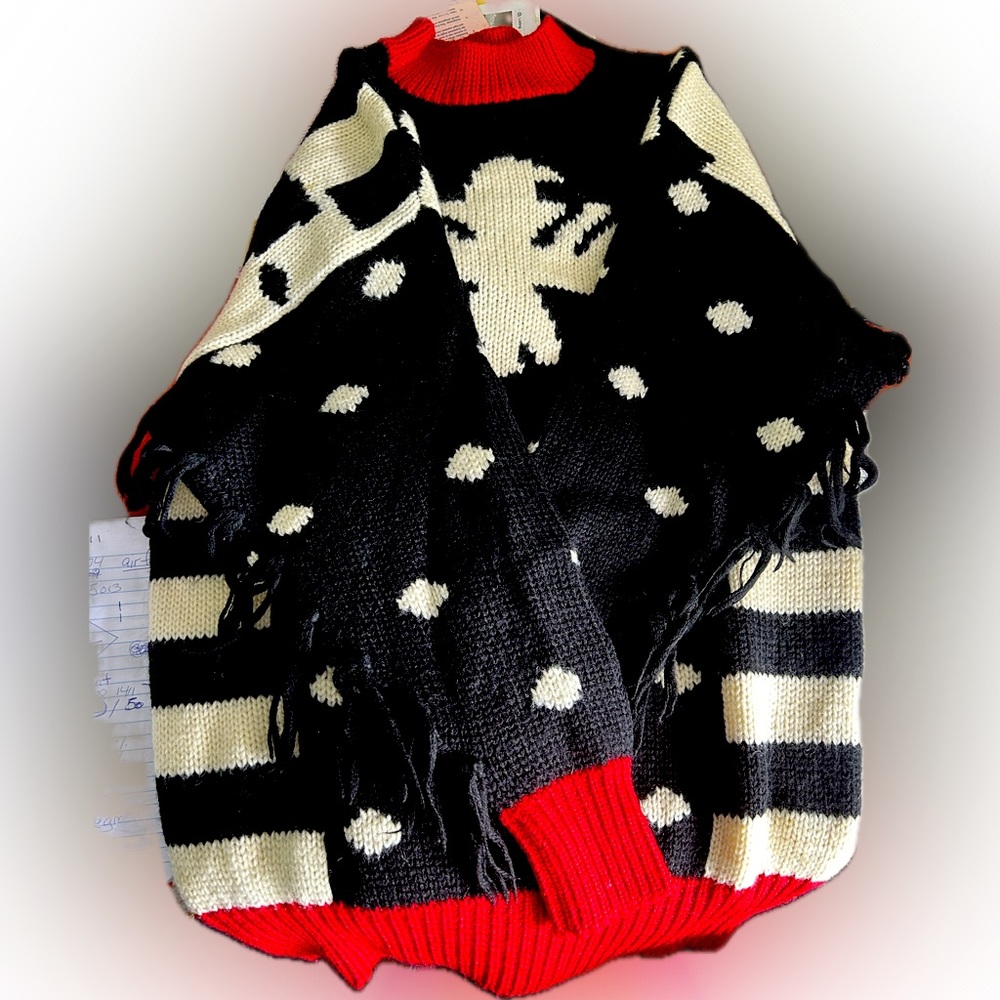 Beautiful 100%-wool sweater with fringed sleeve.